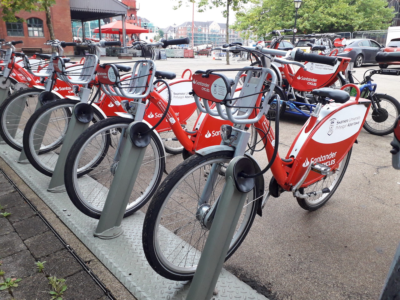 image-red-santander-cycles-parked-at-nextbike-by-tier-bike-rental-station